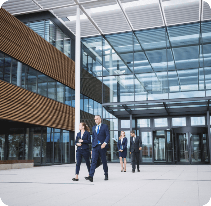 031~business-people-walking-outside-office-building.png